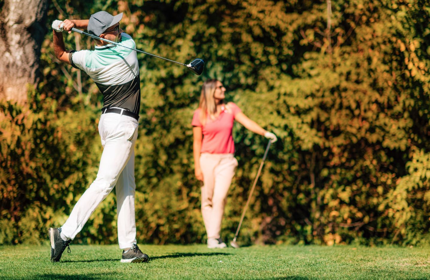 Man and woman golfing 